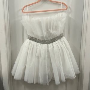 White proofed dress with rhinestone belt, zipper in the back. Never worn hemline